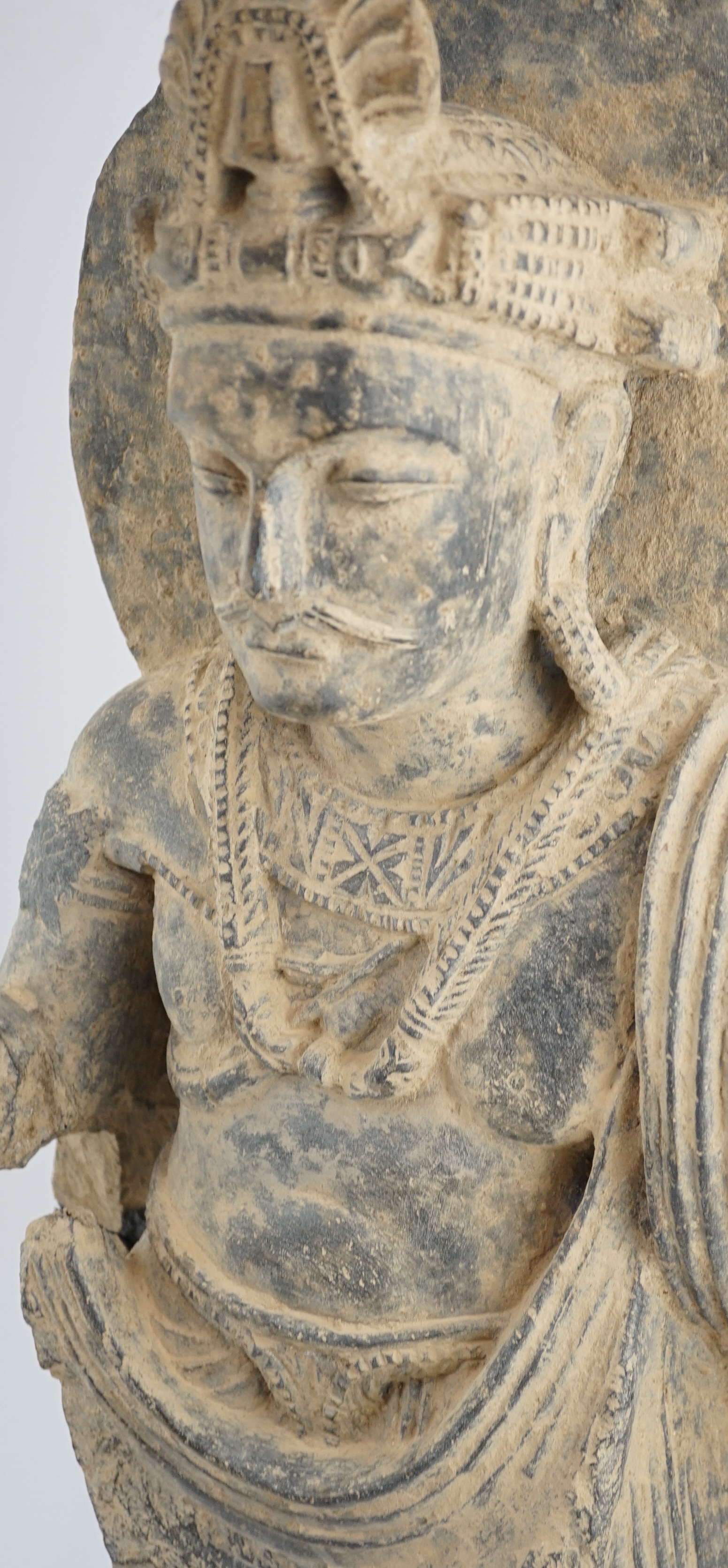 A large grey schist Bodhisattva figure, Gandhara, 2nd/3rd century A.D.